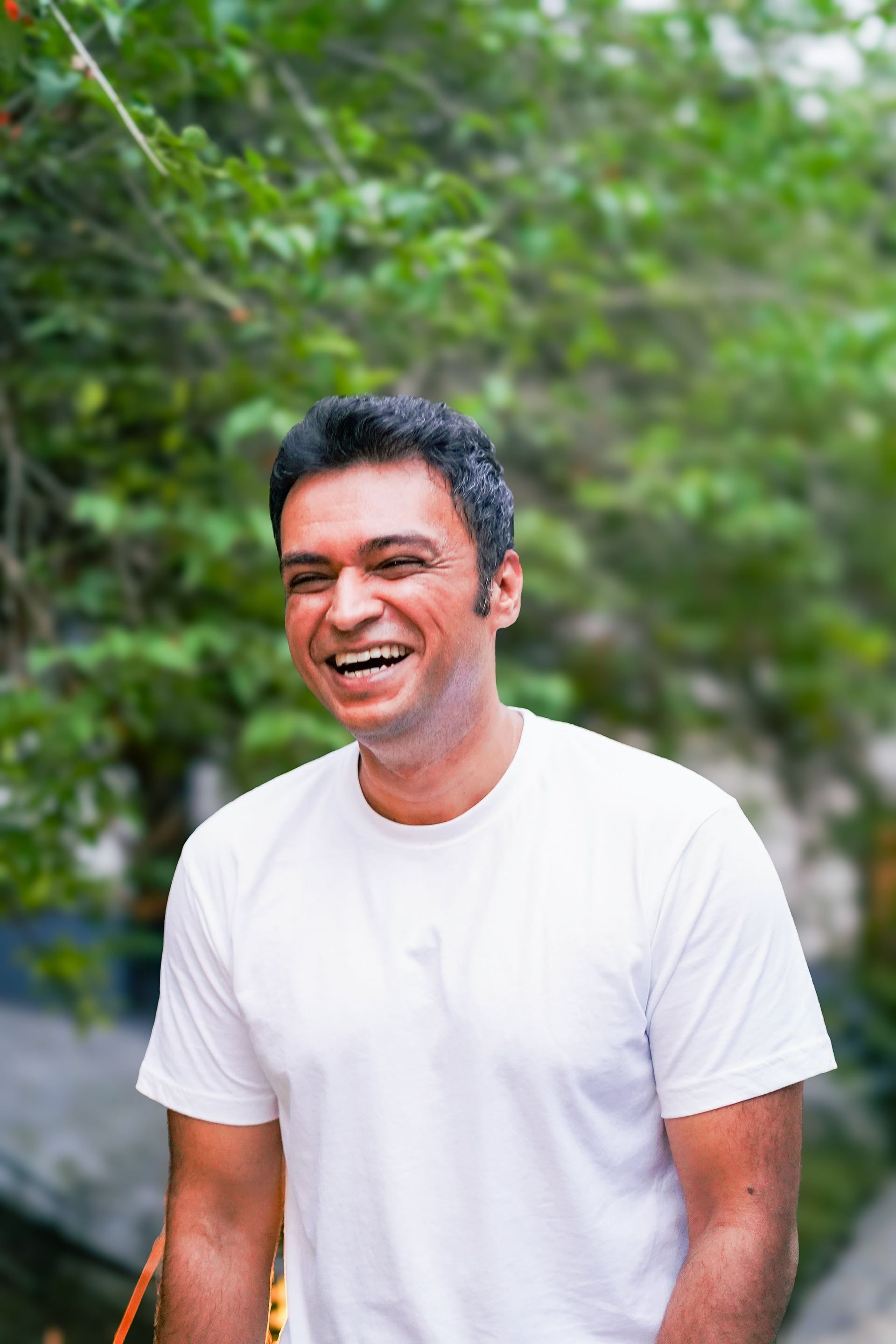 Vishal laughing, outdoors